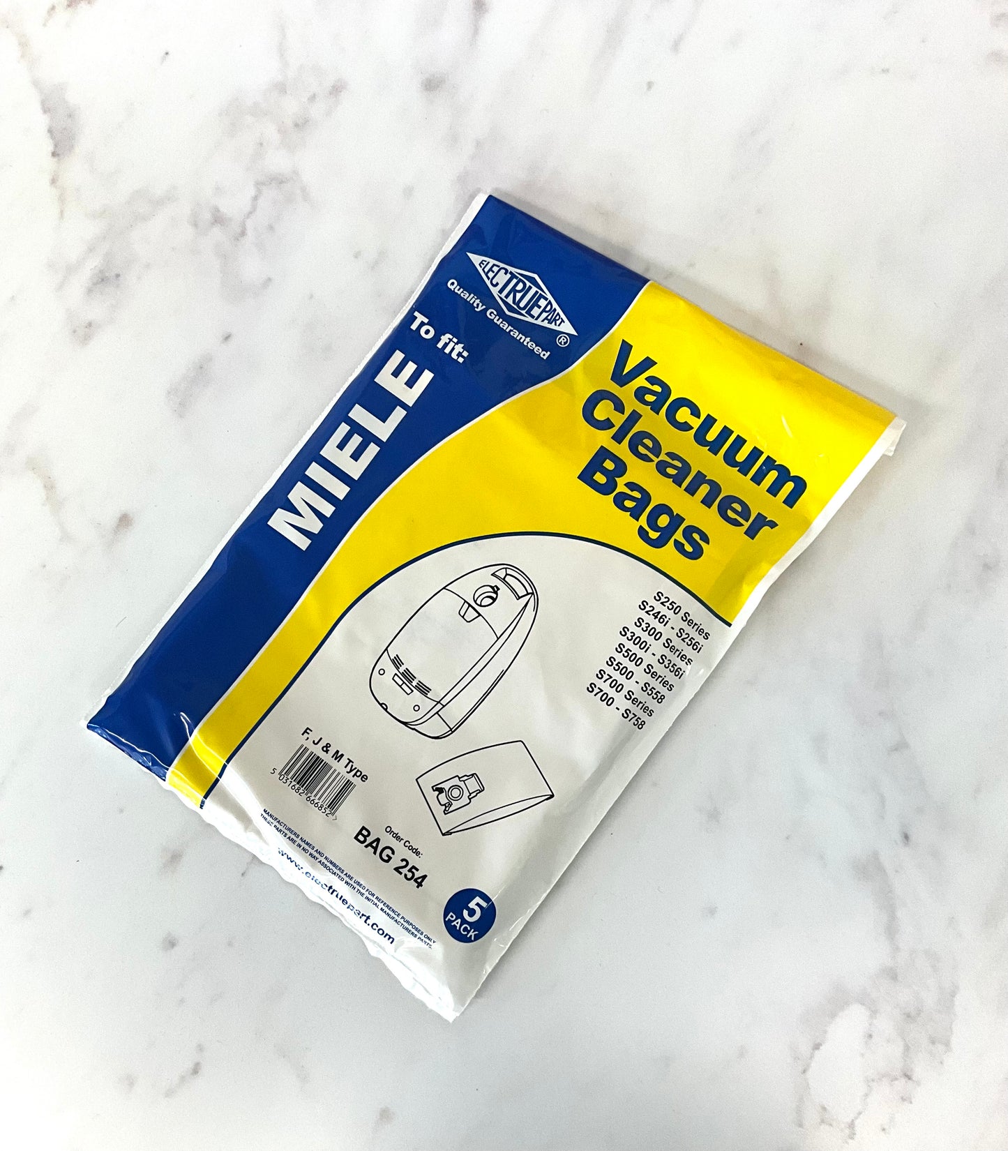 A package of aftermarket Miele Vacuum Cleaner Bags, model BAG 224, containing 5 bags. The packaging features a blue and yellow design with white text, placed on a white marble surface.