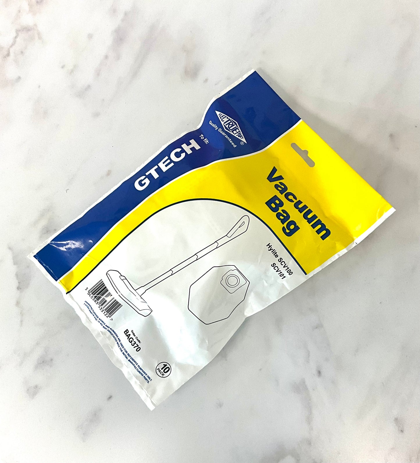 A package of aftermarket Gtech Vacuum Cleaner Bags, model BAG 370, containing 10 bags. The packaging features a blue and yellow design with white text, placed on a white marble surface.