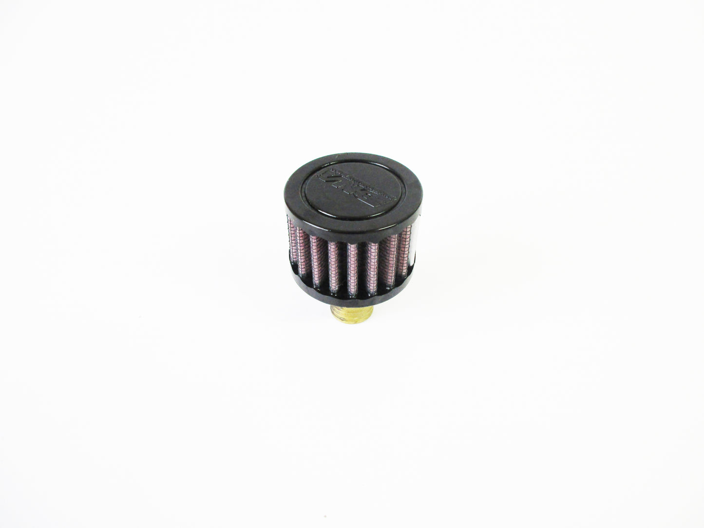 A small cylindrical crank case vent with a black top cap, red pleated media, and a brass-coloured bottom fitting, photographed on a plain white background.