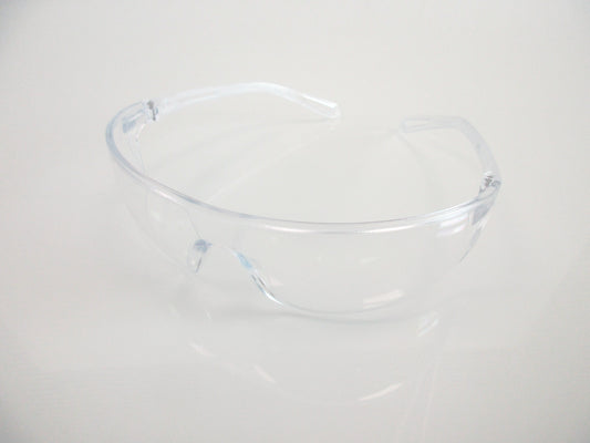 Clear plastic safety glasses, with transparent lenses, shown on a plain white background.