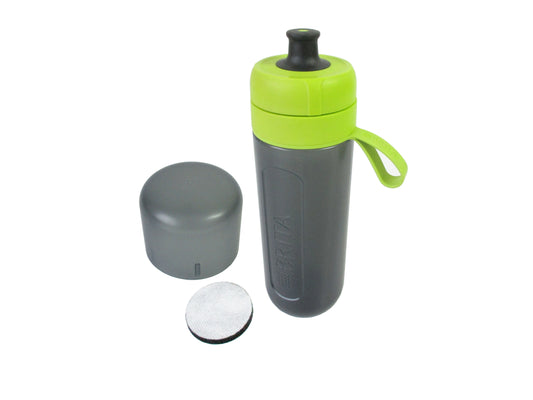A grey bodied water filter bottle with a bright lime green lid, and carrying loop, shown with its grey cap and a round filter disc on a white background.