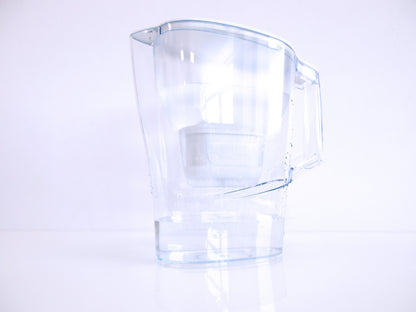 A clear plastic water filter jug, with a handle and spout, shown on a clean white background with a soft reflection below.