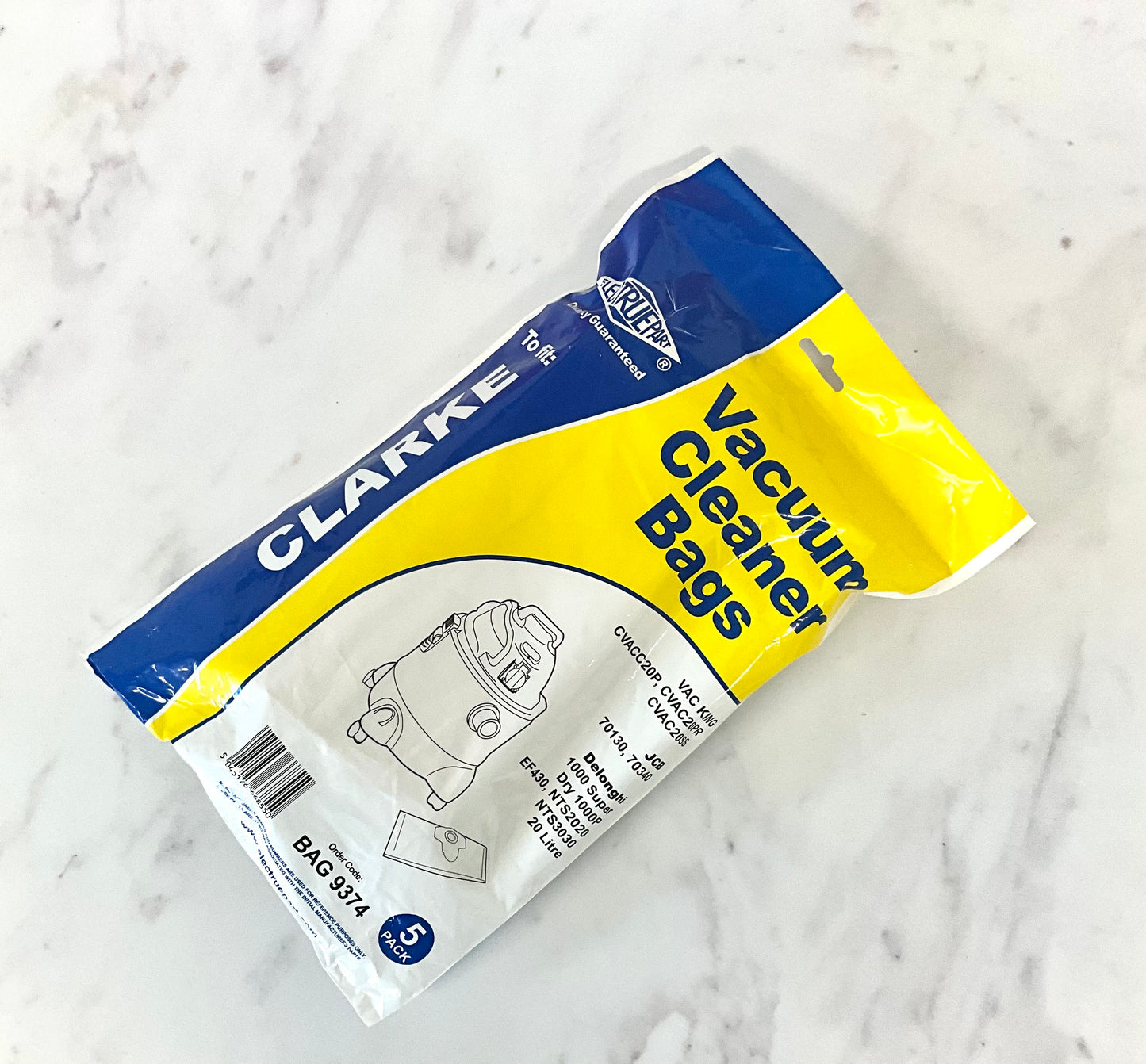 A package of aftermarket Clarke replacement vacuum cleaner bags, pack of 5, shown on a white marble surface. The packaging is blue and yellow with white text and a line drawing of a vacuum cleaner.