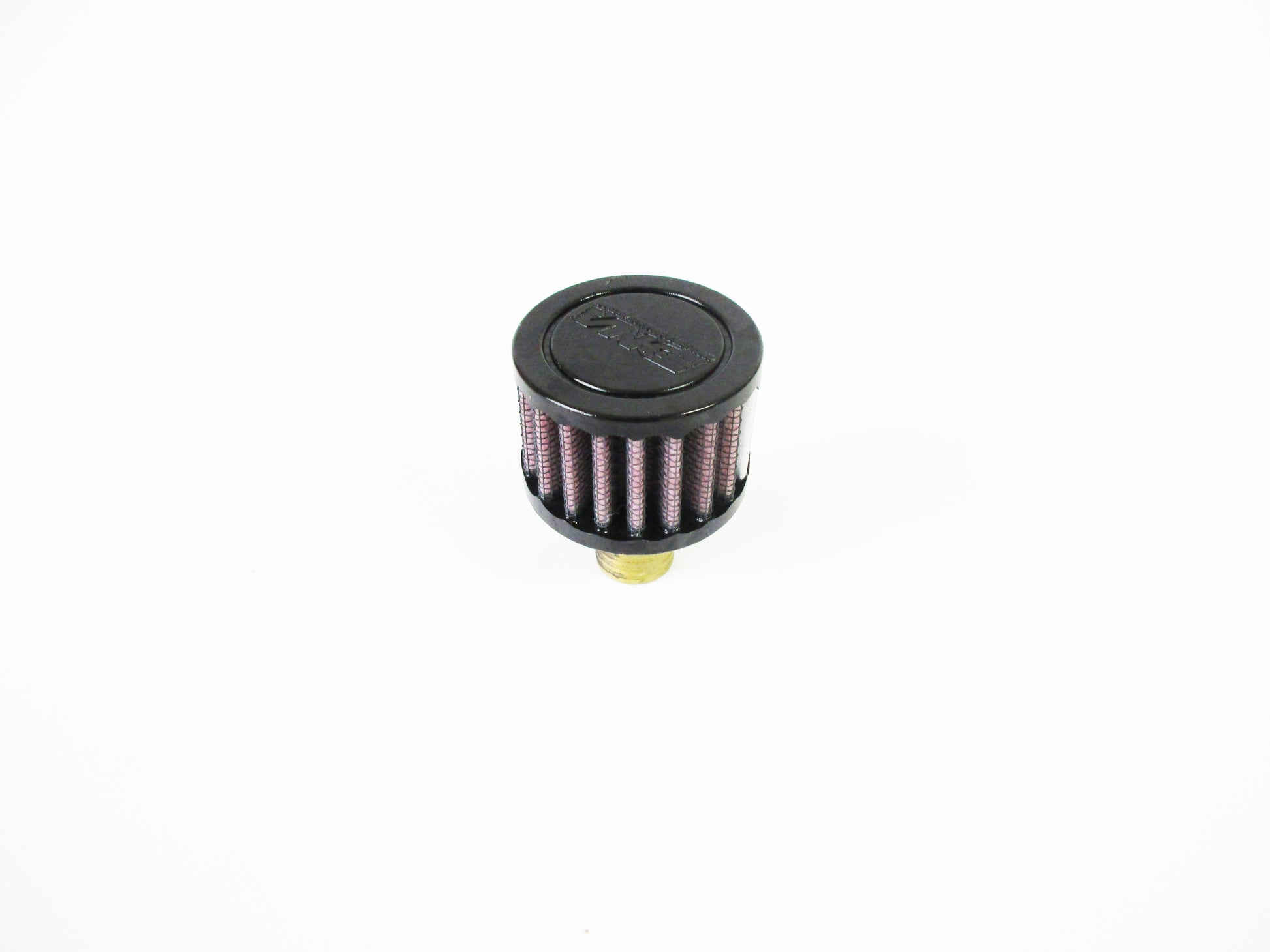 A small cylindrical crank case vent with a black top cap, red pleated media, and a brass-coloured bottom fitting, photographed on a plain white background.