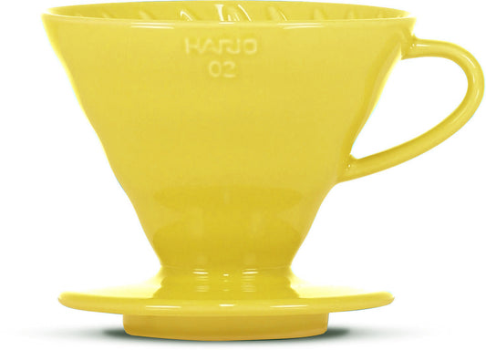 A bright yellow ceramic pour-over coffee dripper, featuring the embossed brand name 'HARIO 02' on the front, set against a plain white background.
