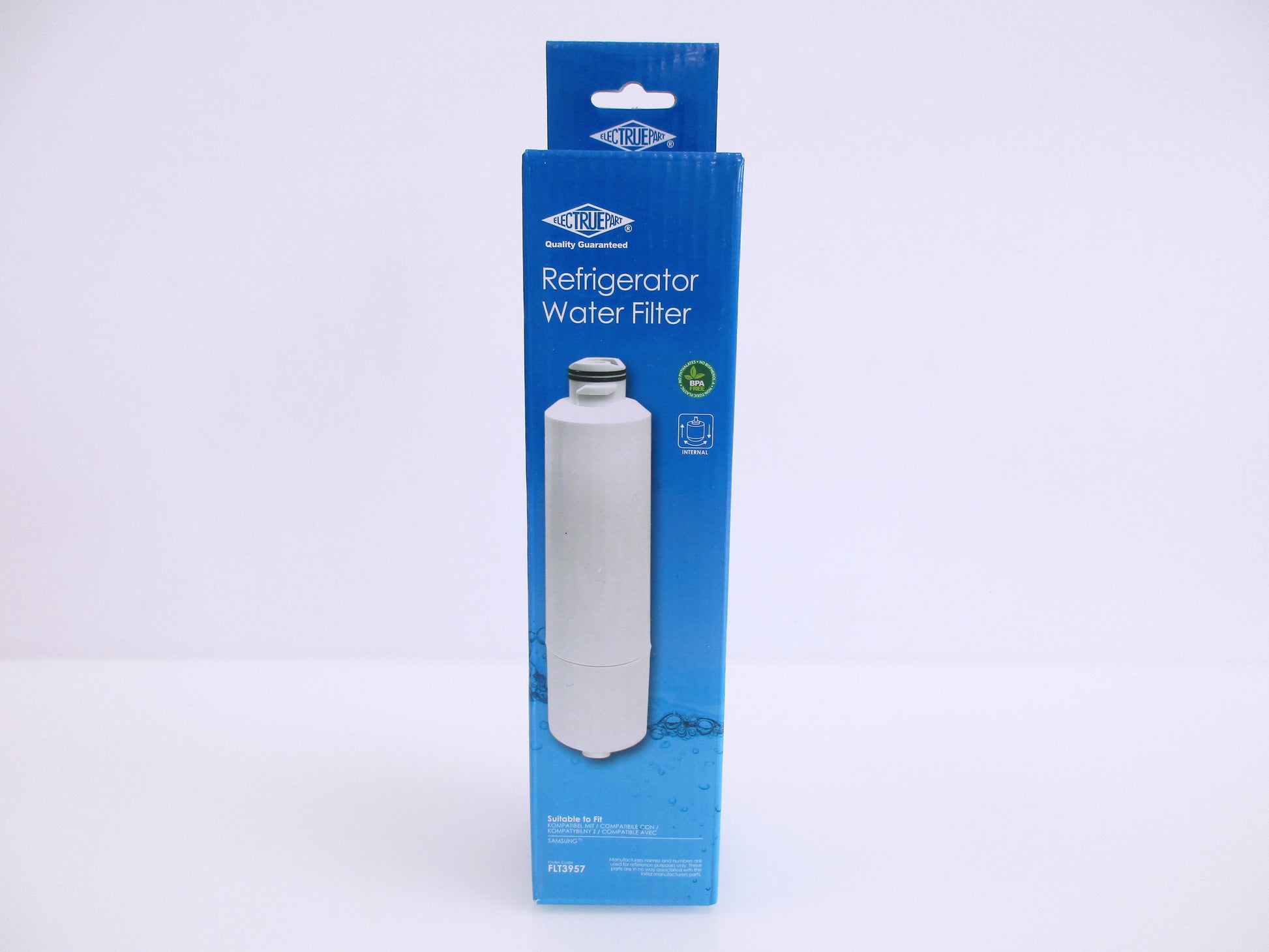 A boxed FLT3957 refrigerator water filter package standing upright on a plain white background. The retail box is predominantly blue with a photo of a white cylindrical filter on the front.
