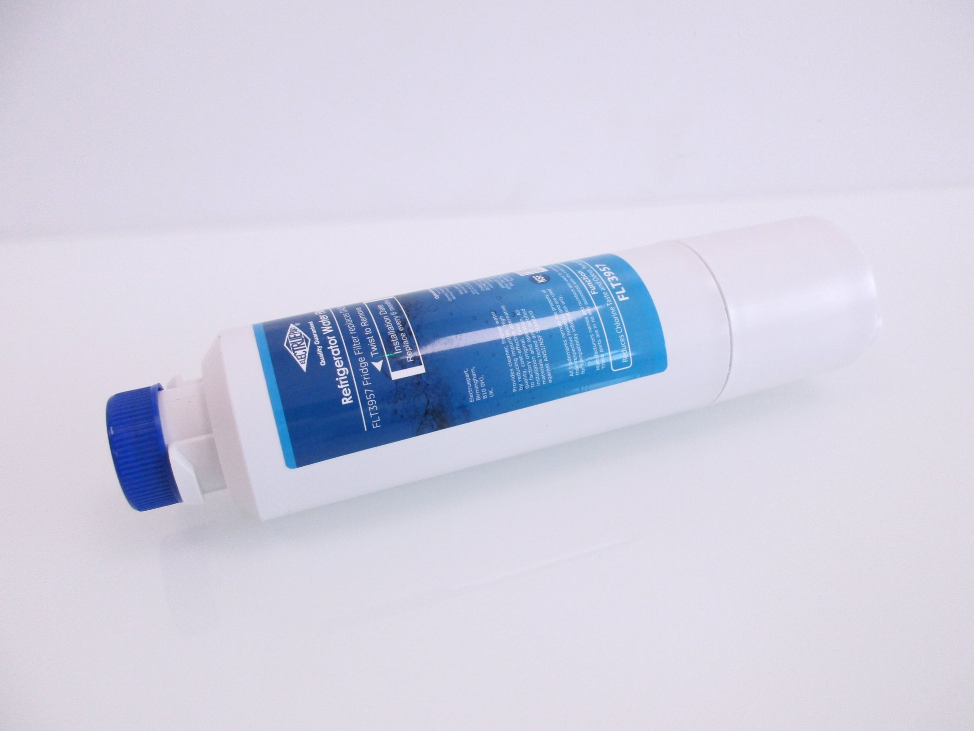A white cylindrical refrigerator water filter cartridge with a blue cap and a blue label, displaying the part number FTL3957, shown on a plain white background.