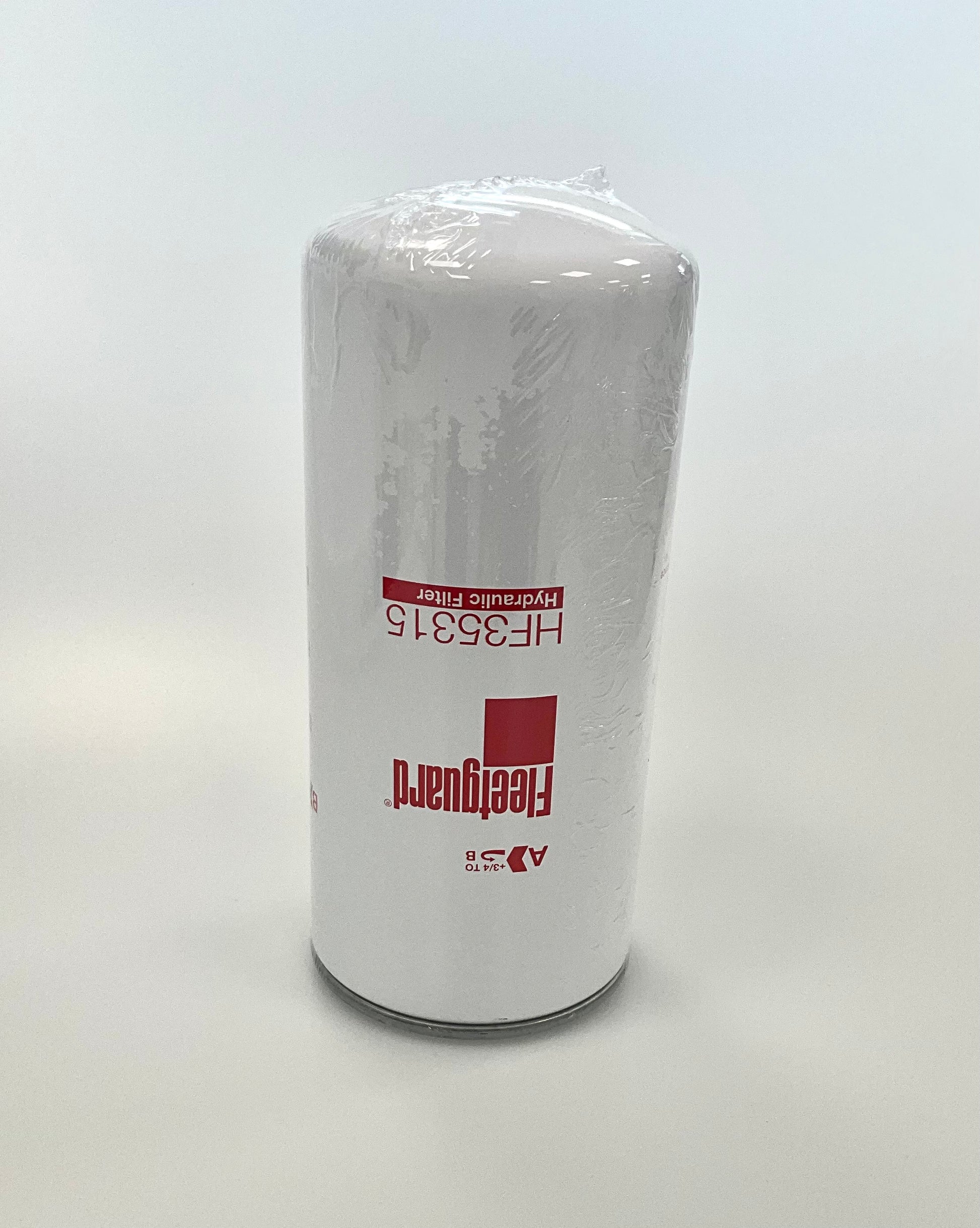 A cylindrical white hydraulic filter cartridge wrapped in protective plastic, featuring HF35315 red printed text and the Fleetguard brand logo, set against a plain light grey background.