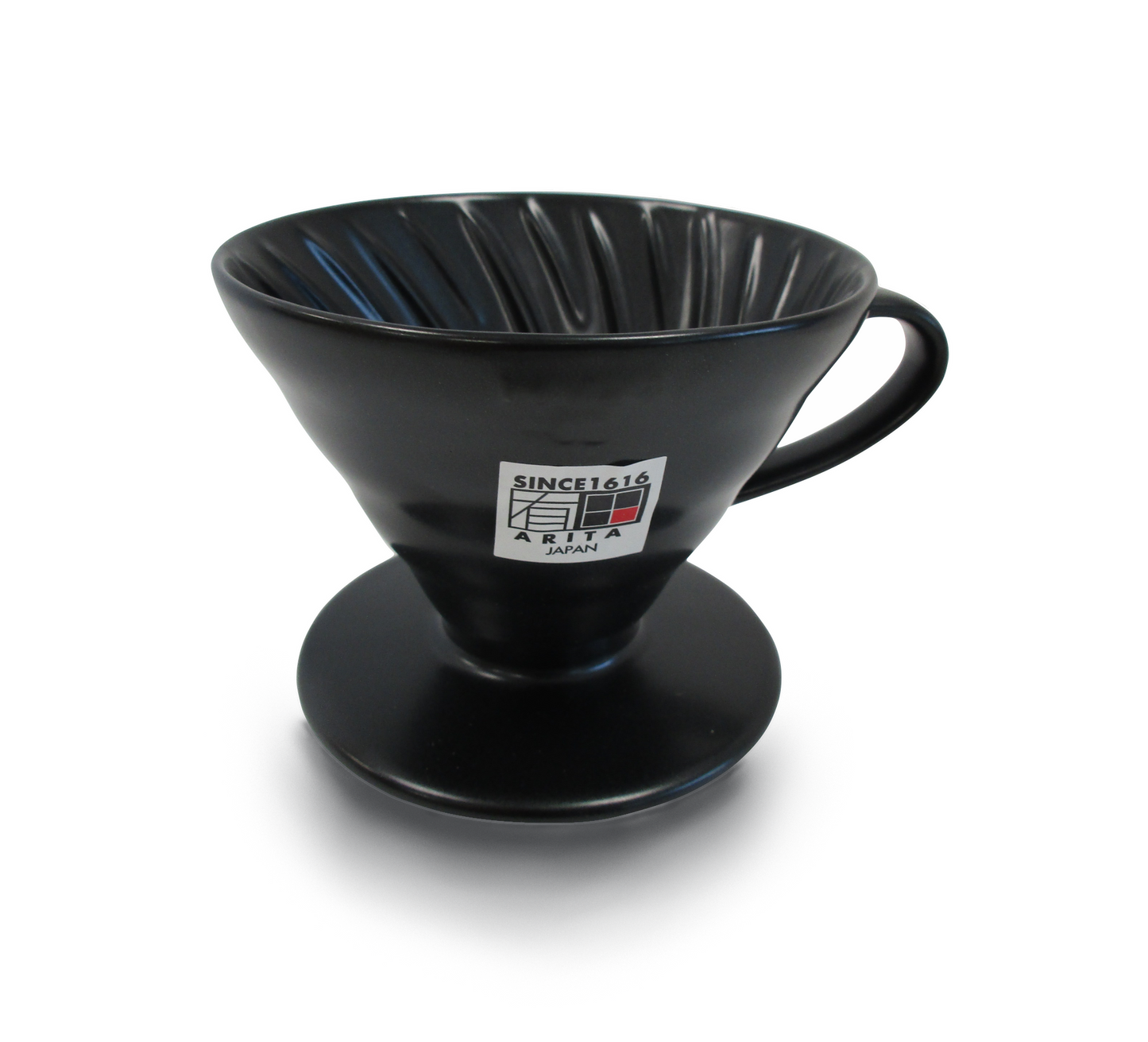 A black ceramic pour-over coffee dripper with a handle and a circular base, featuring a white and black 'SINCE 1616 ARITA JAPAN' sticker on the front, set against a plain white background.