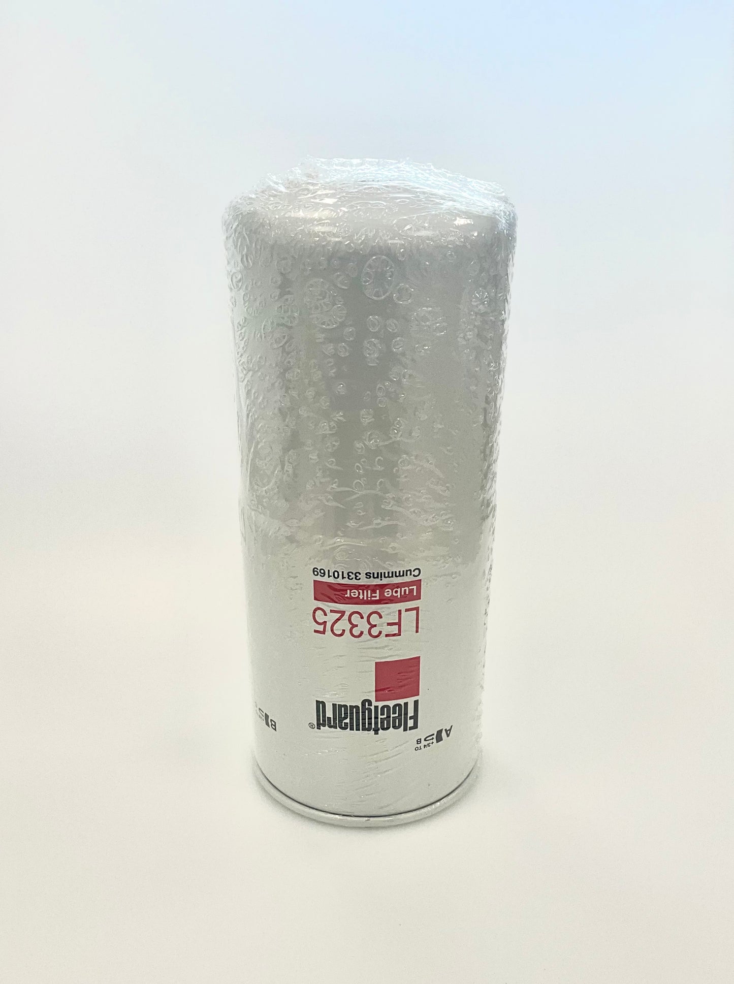 A cylindrical Fleetguard oil filter wrapped in clear protective plastic, displaying LF3325, standing upright on a white background.