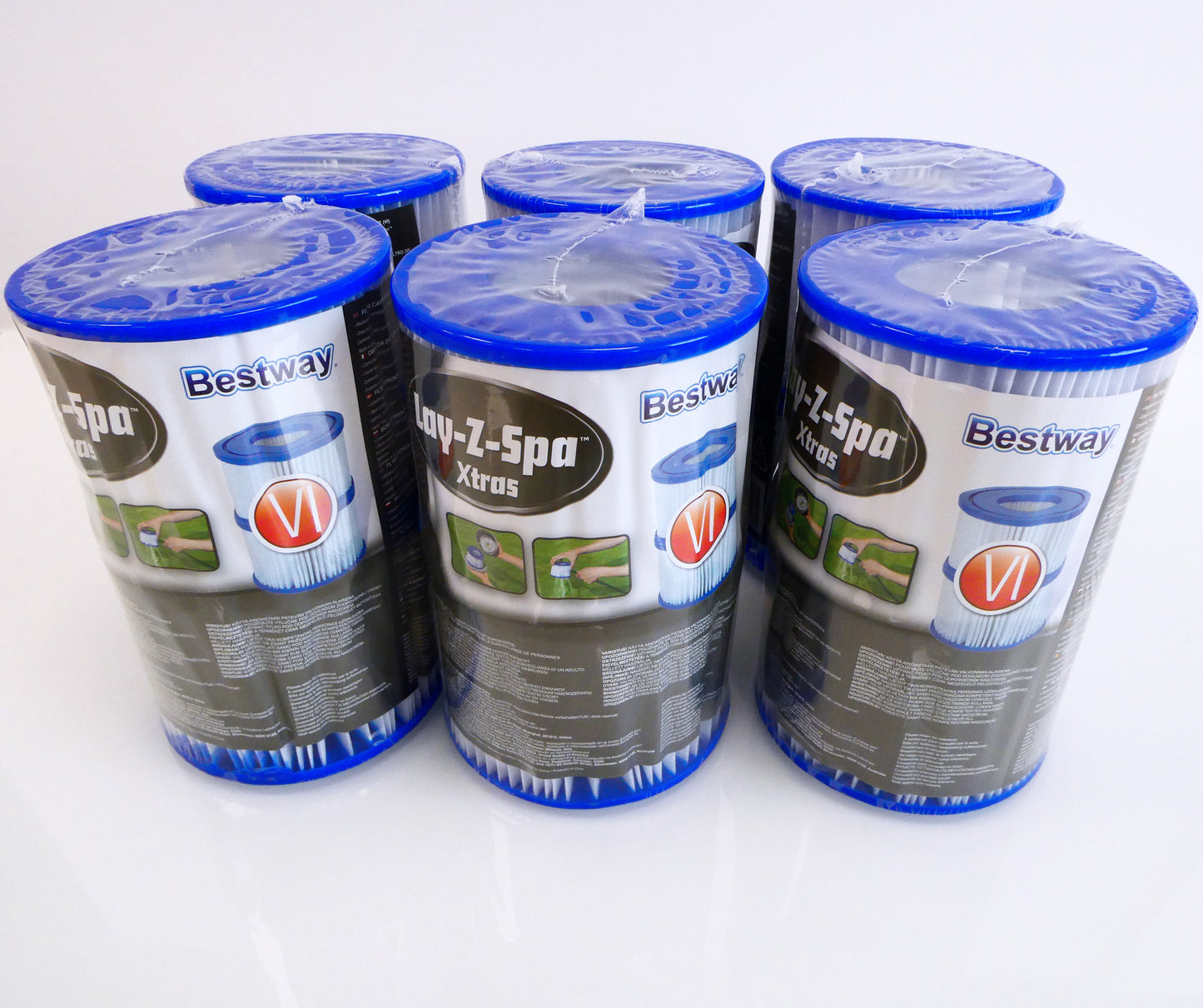 Six Bestway Lay-Z-Spa water filter two packs. Shown in there protective plastic covering, and branded packaging. Filters have a blue PU top and bottom, also they have white pleated filter media.
