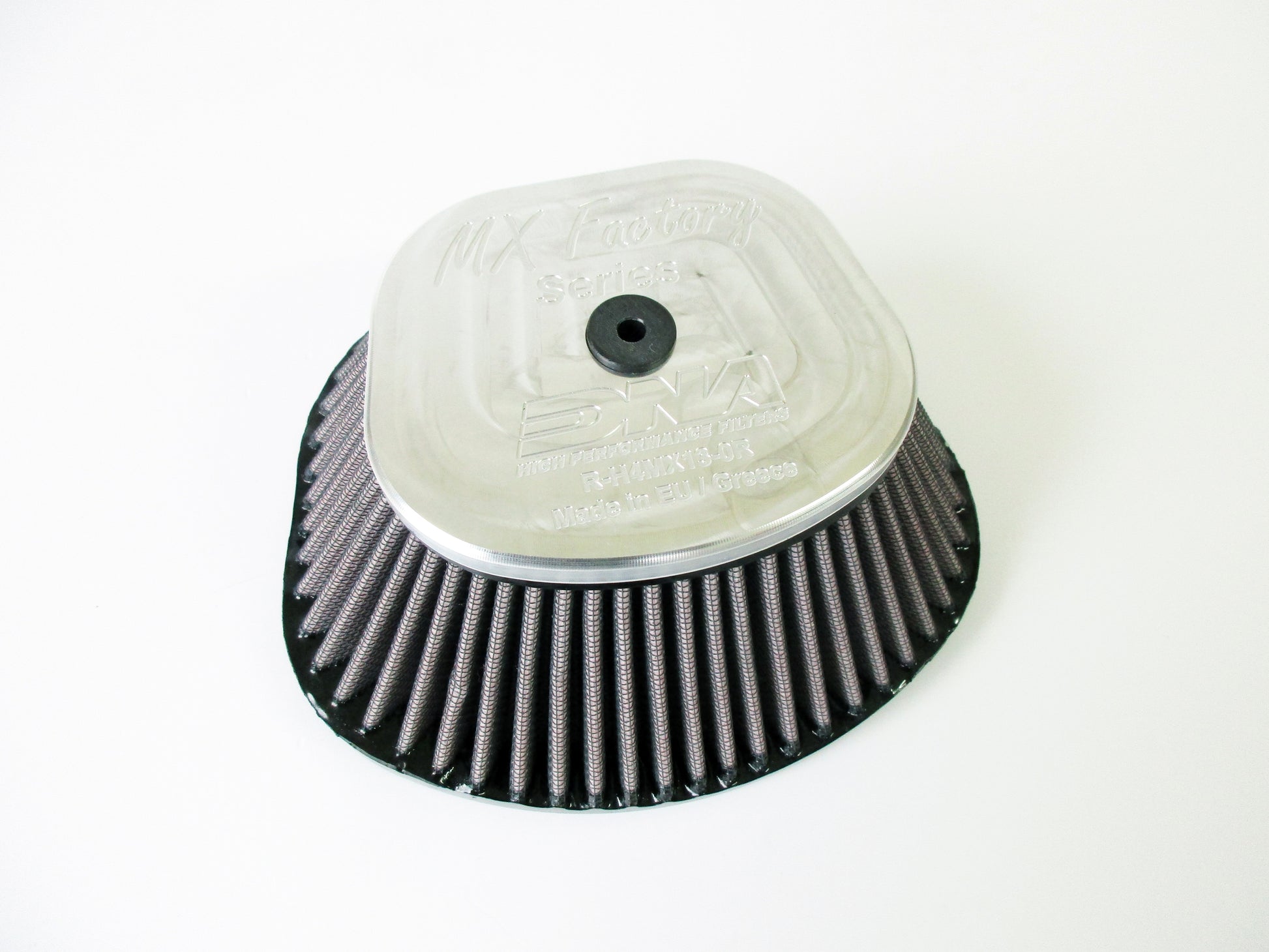 A DNA high performance motocross air filter, with a pleated media and grey metal top cover, shown on a plain white background.