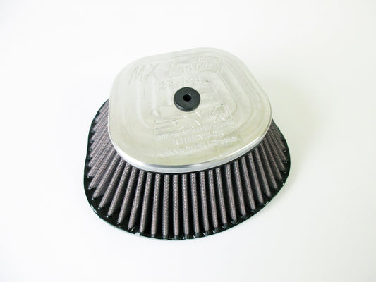 A DNA high performance motocross air filter, with a pleated media and grey metal top cover, shown on a plain white background.
