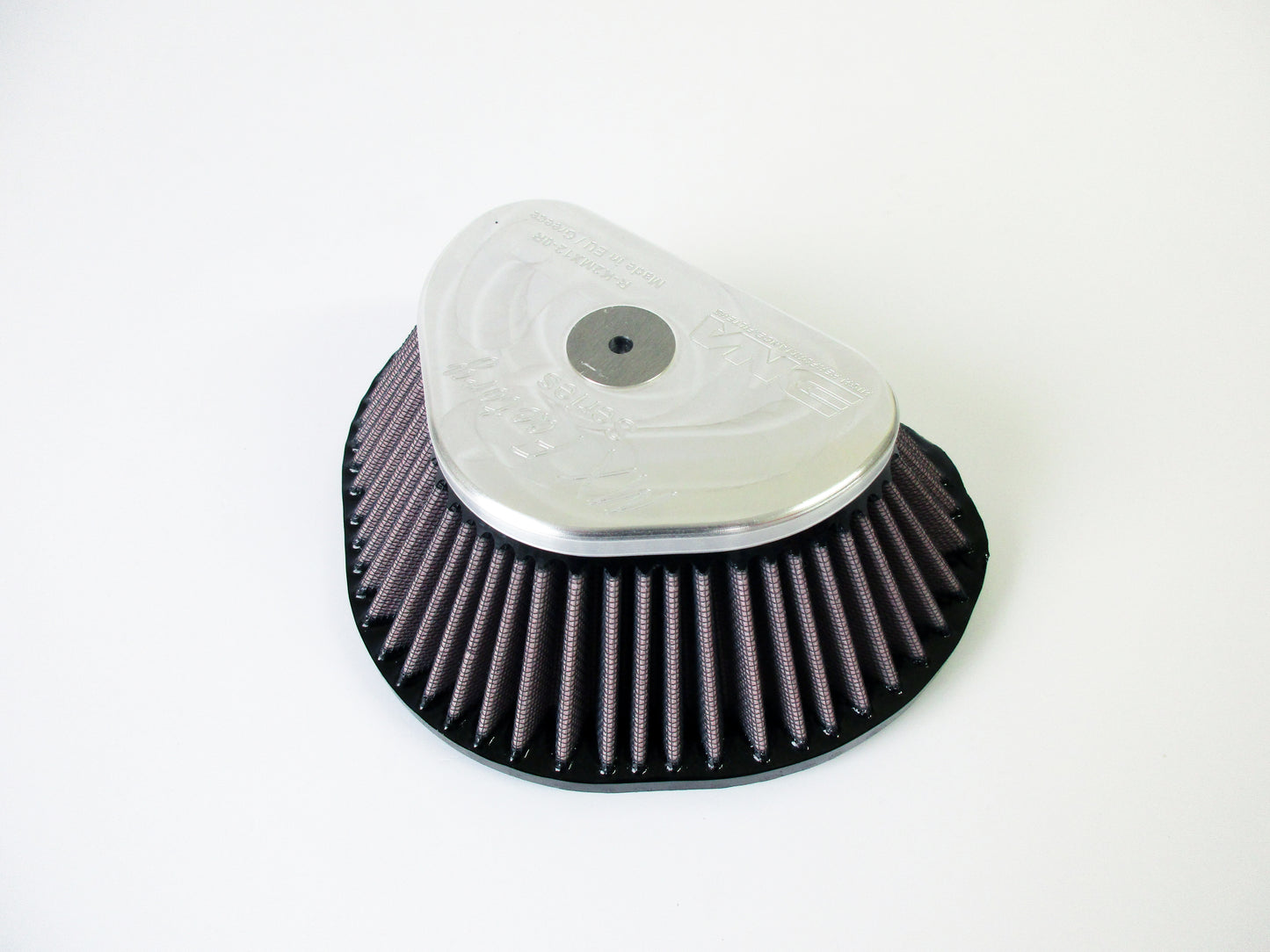 A triangular Motocross air filter with a pleated high performance media and a grey metal top cap, photographed on a plain white background.