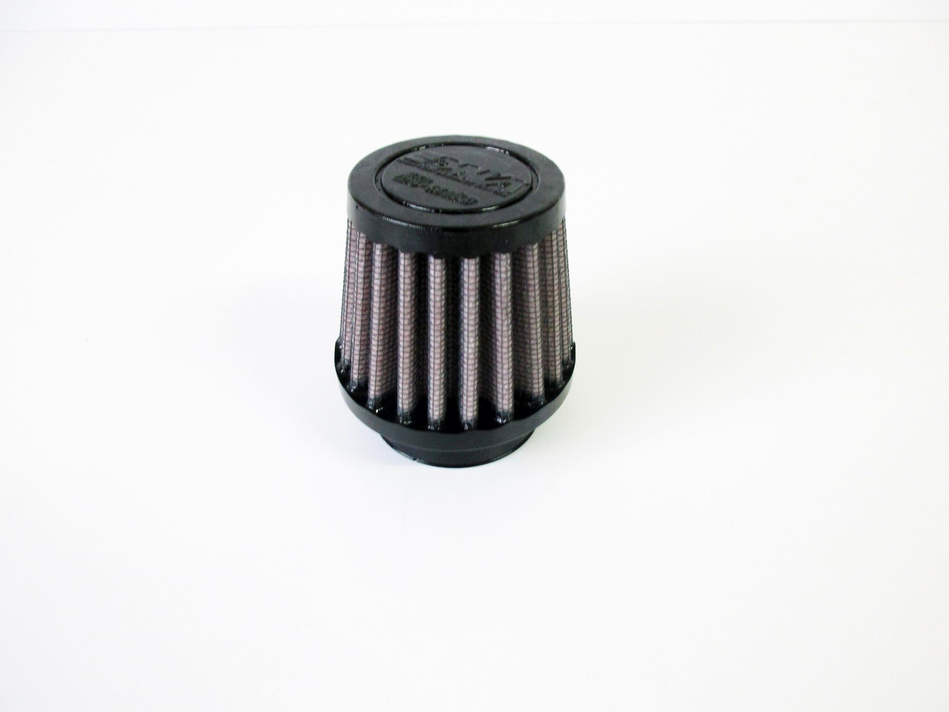 A small cylindrical universal air filter with a black top cap and pleated filter media, shown on a plain white background.